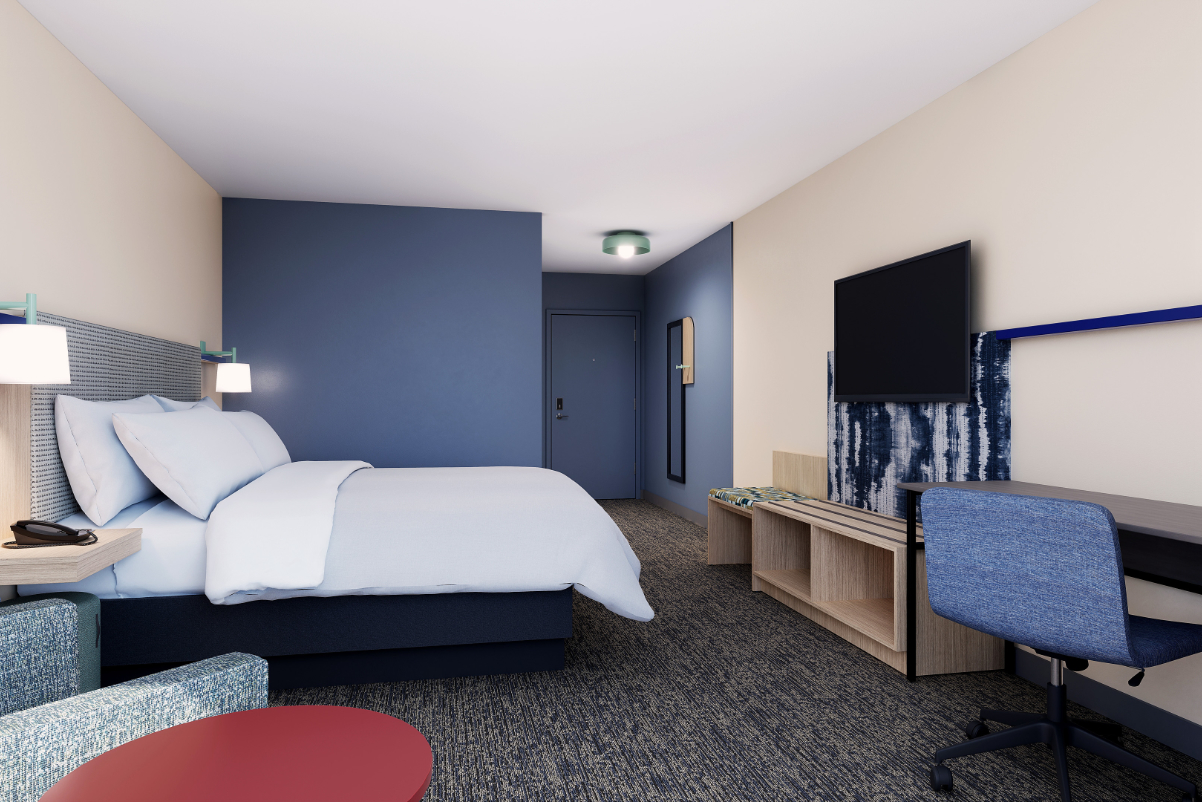 A view of a guest room with a king bed at IHG’s new brand, Garner. Source: IHG.